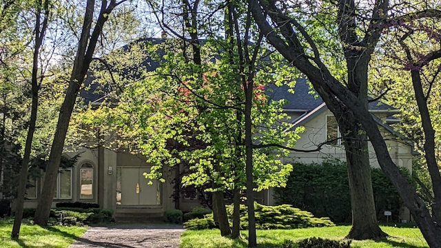 view of property hidden behind natural elements