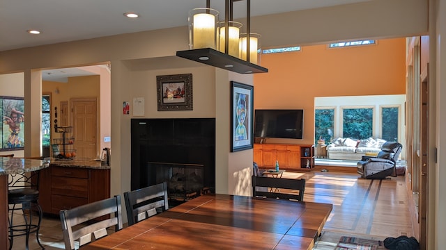 dining space with a notable chandelier and wood-type flooring