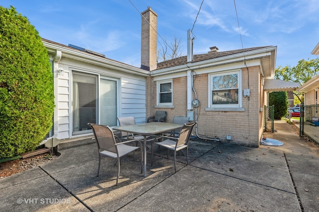 back of house with a patio