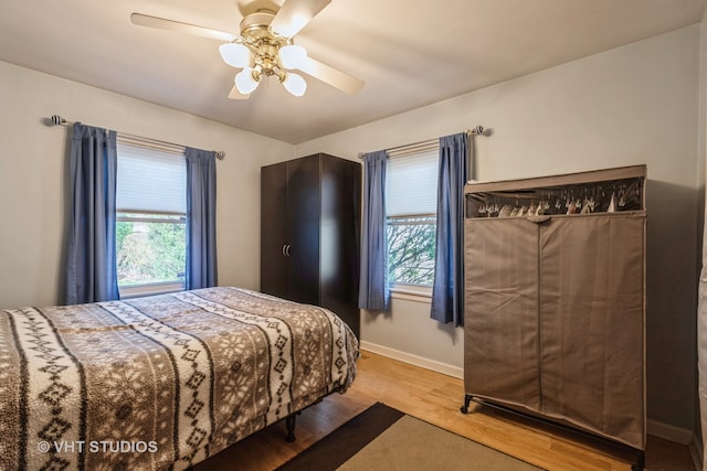 bedroom featuring hardwood / wood-style flooring and ceiling fan