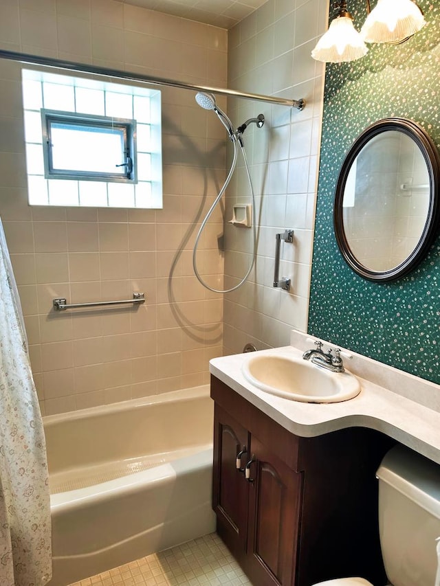 bathroom with wallpapered walls, toilet, shower / tub combo with curtain, tile patterned flooring, and vanity