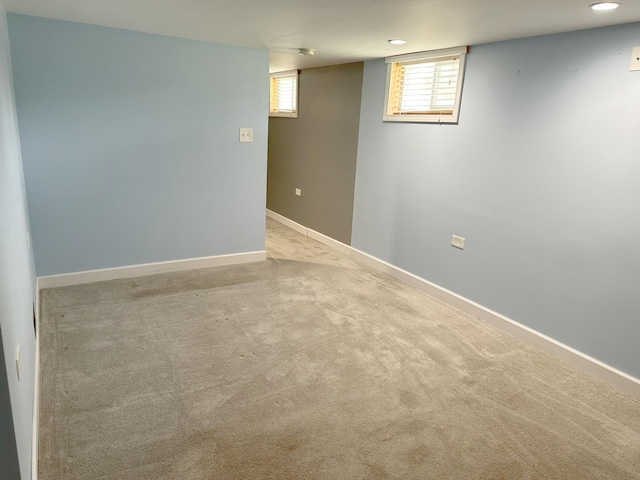 basement with carpet floors, baseboards, and recessed lighting