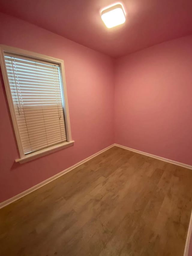 spare room featuring hardwood / wood-style floors