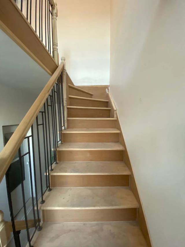 staircase with concrete flooring