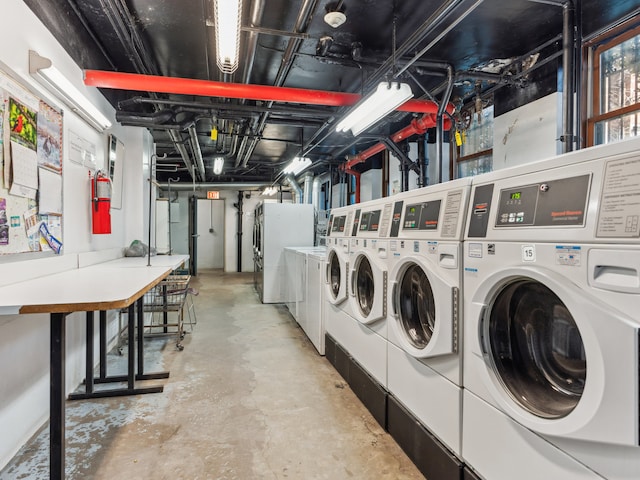 washroom with washing machine and clothes dryer