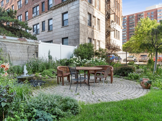 surrounding community with a patio area