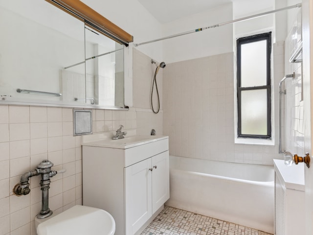 full bathroom featuring a healthy amount of sunlight, tile patterned floors, toilet, and vanity