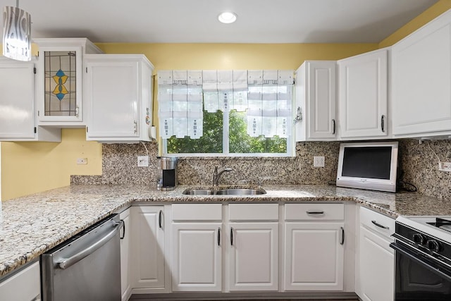 kitchen with light stone countertops, stainless steel dishwasher, sink, white cabinetry, and hanging light fixtures