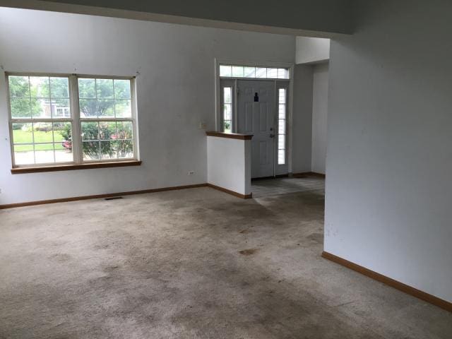 view of carpeted entrance foyer