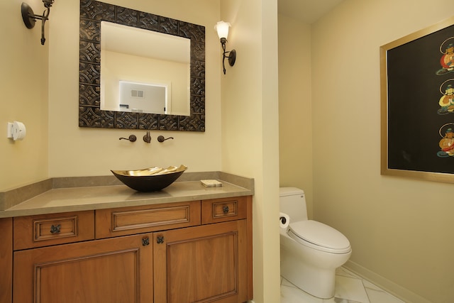 bathroom with tile patterned floors, toilet, and vanity