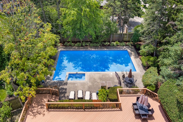 view of swimming pool with a deck