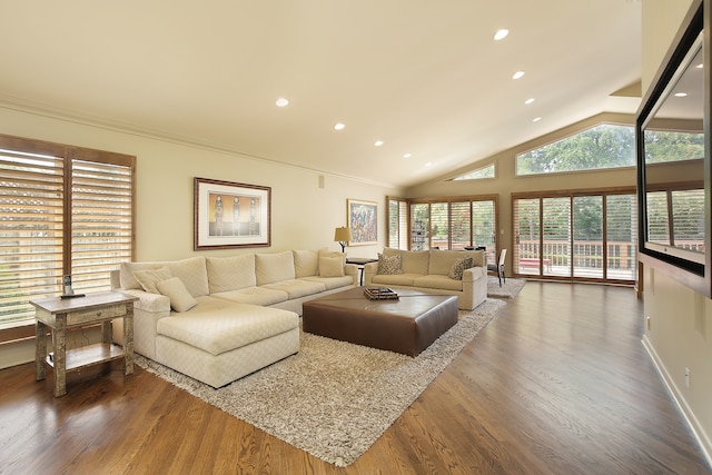 living room with ornamental molding, vaulted ceiling, and dark hardwood / wood-style floors