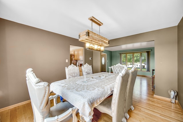 dining space featuring light hardwood / wood-style floors