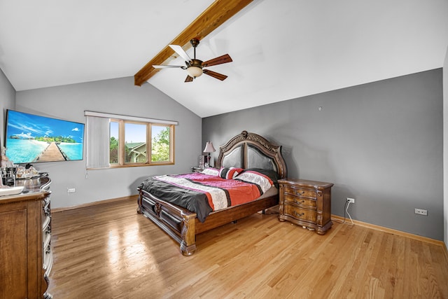 bedroom featuring lofted ceiling with beams, light wood-type flooring, and ceiling fan