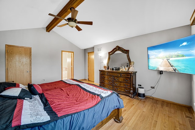 bedroom featuring vaulted ceiling with beams, ceiling fan, ensuite bathroom, and hardwood / wood-style flooring