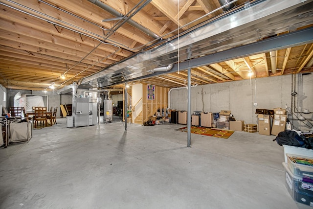 basement featuring water heater and heating unit