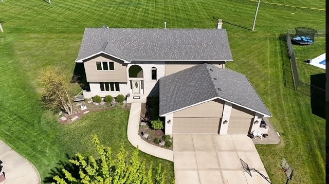 birds eye view of property with a rural view