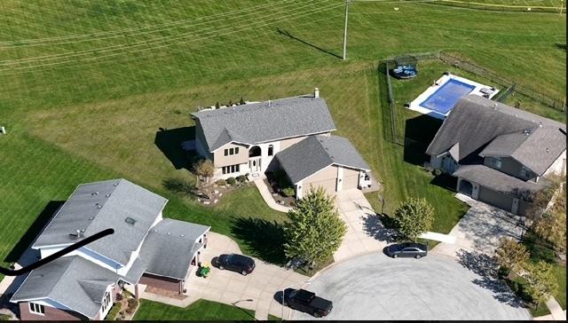 birds eye view of property featuring a rural view