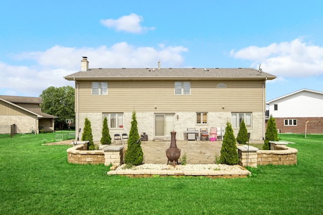 back of house with a patio and a lawn