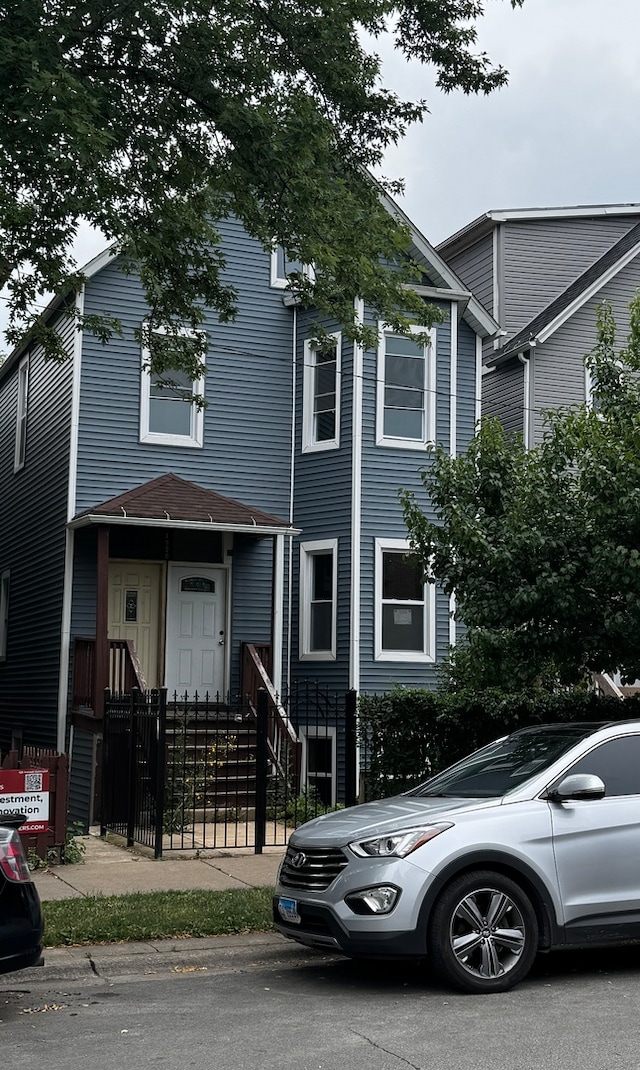 view of front of property with fence