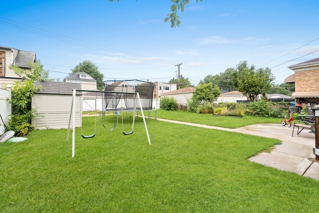 view of yard featuring a playground and a patio