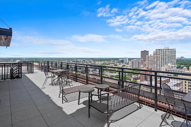 view of patio featuring a balcony