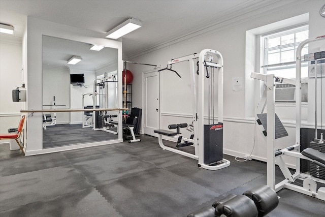 gym featuring cooling unit and ornamental molding