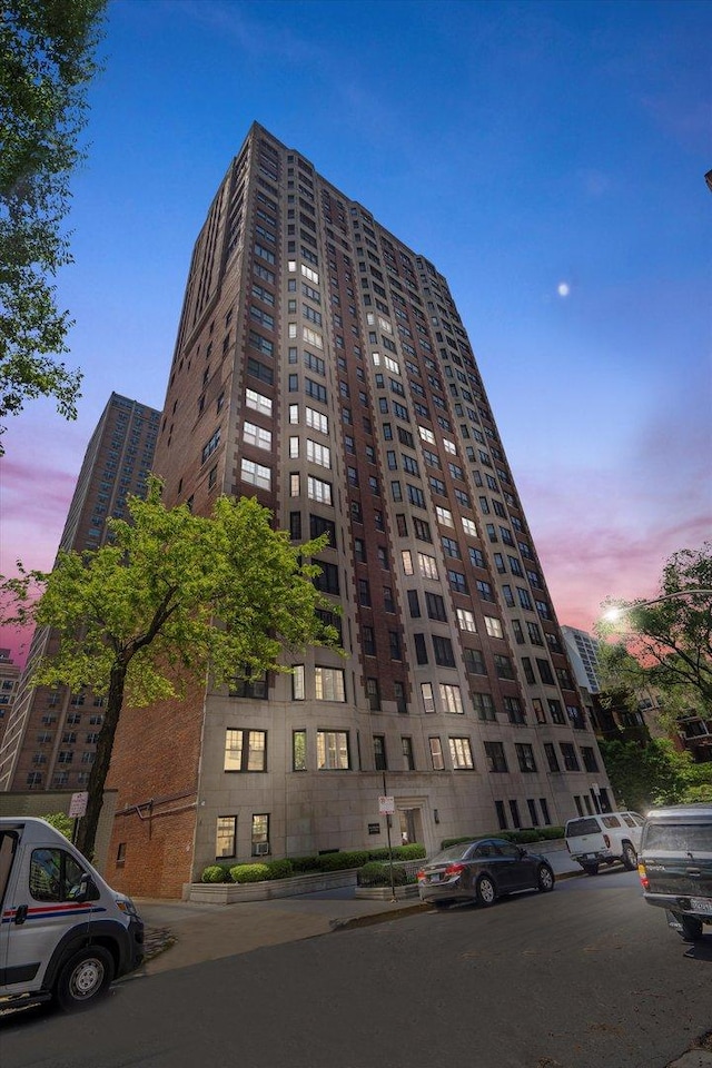 view of outdoor building at dusk