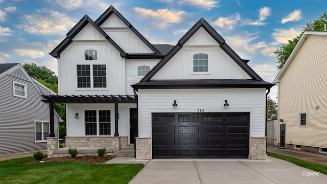 view of front of house featuring a garage and a pergola