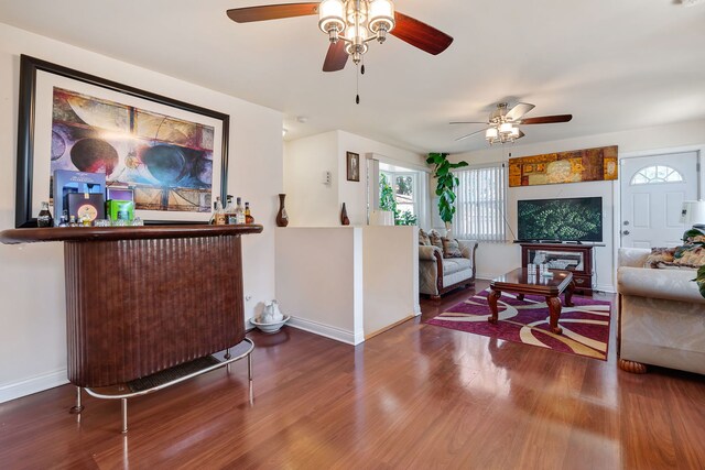 interior space featuring ceiling fan and dark hardwood / wood-style flooring