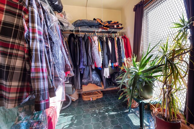 spacious closet featuring tile patterned flooring