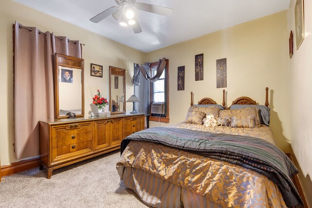 carpeted bedroom featuring cooling unit and ceiling fan