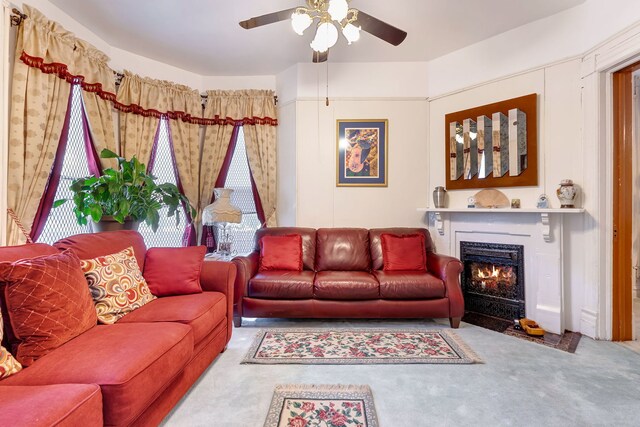 living room with carpet flooring and ceiling fan