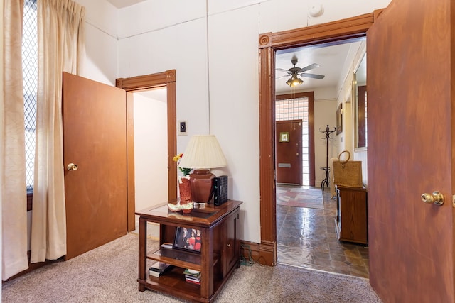 hallway featuring carpet