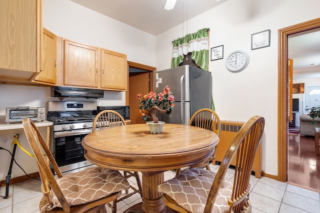 dining area with ceiling fan and light wood-type flooring