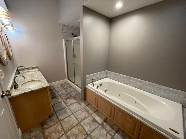 bathroom featuring vanity and separate shower and tub