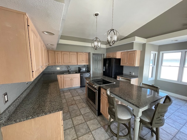 kitchen with black appliances, vaulted ceiling, pendant lighting, decorative backsplash, and light brown cabinets