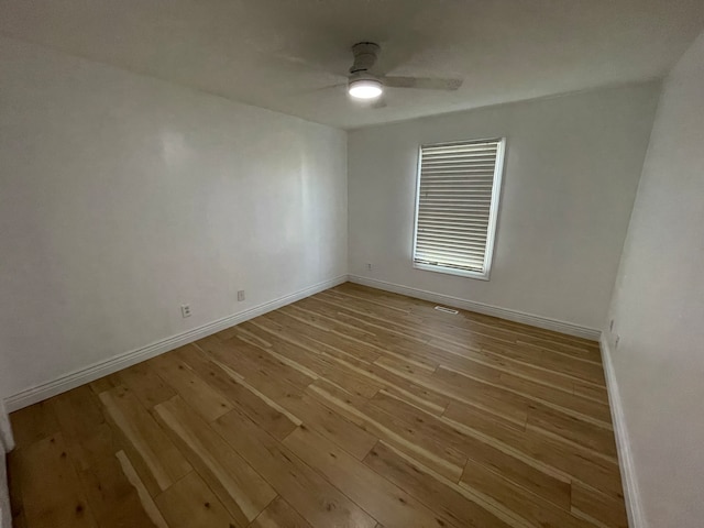 empty room featuring light hardwood / wood-style floors and ceiling fan