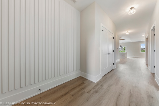 hall with light hardwood / wood-style flooring