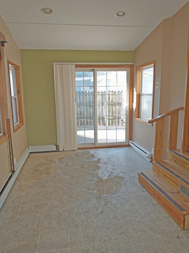 empty room featuring a baseboard heating unit