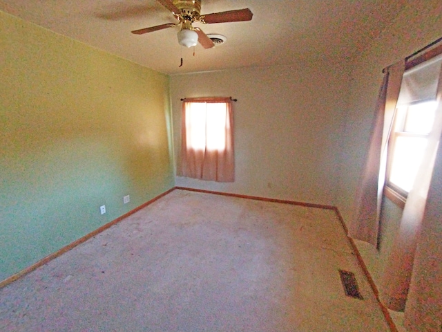 carpeted empty room with ceiling fan