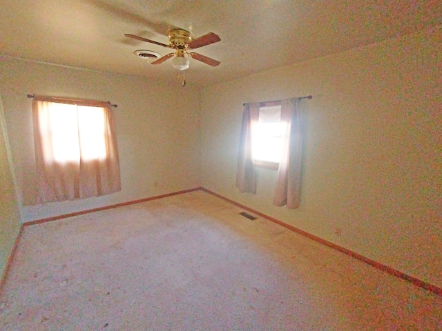 empty room with carpet floors and ceiling fan