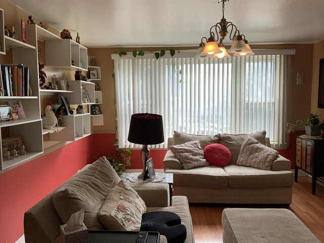 2323 N Keating Ave, Chicago, IL 60639 - living room featuring a chandelier and wood finished floors
