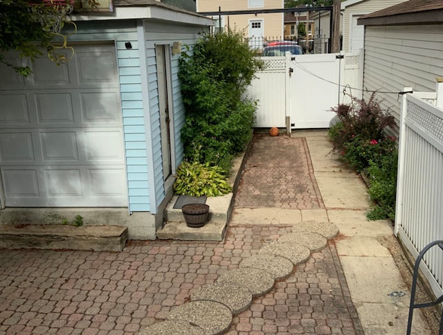 view of patio / terrace featuring a garage