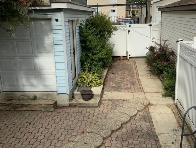 2323 N Keating Ave, Chicago, IL 60639 - view of patio / terrace featuring a garage and fence