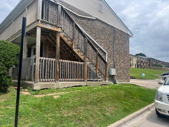 view of side of home featuring a yard