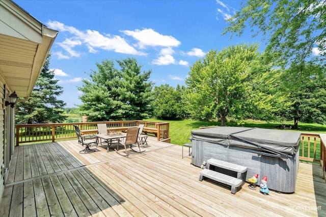 wooden terrace featuring a hot tub