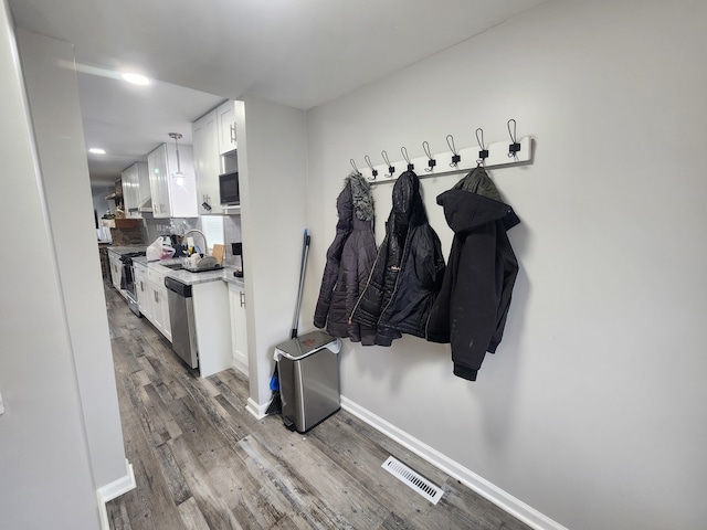 mudroom featuring wood-type flooring