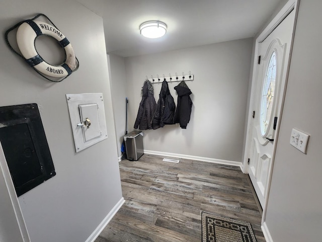 mudroom featuring baseboards and wood finished floors