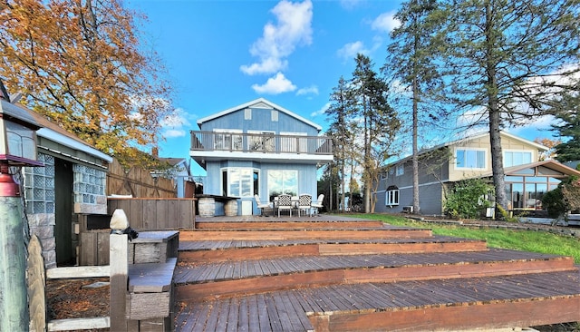 view of front of home with a balcony